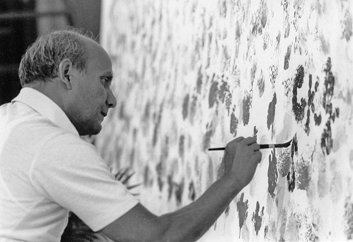 Sri Chinmoy working on a large painting.
