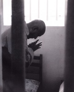 Sri Chinmoy praying in Nelson Mandela's cell.