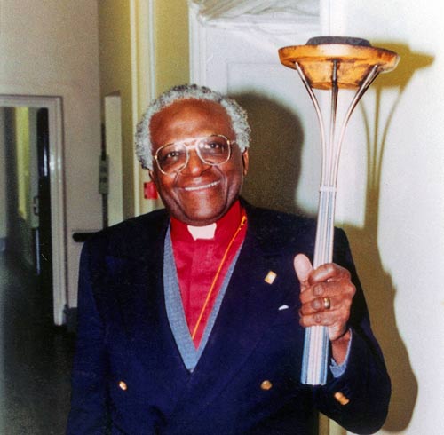 Archbishop Tutu blesses the Sri Chinmoy Oneness-Home Peace Run Torch, June 14th, 1993.